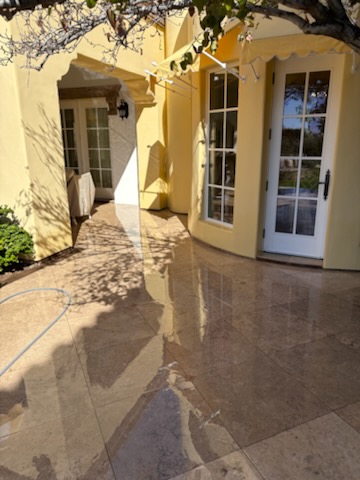 Freshly cleaned stone patio with French doors