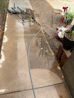 Sidewalk being pressure washed