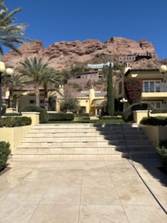 Luxury property with steps and mountain backdrop